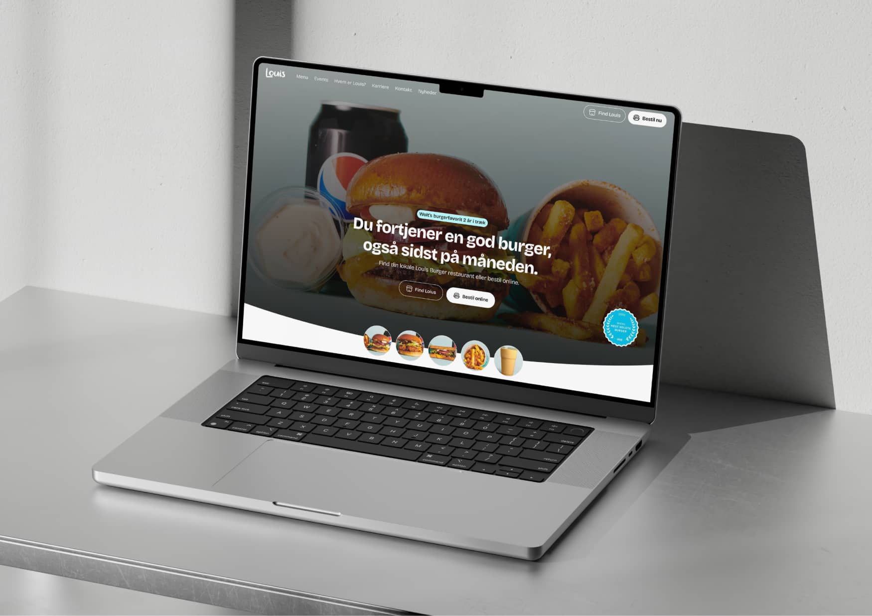 Louis Burger website homepage on a laptop